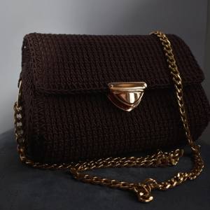 Handmade brown crochet bag with a gold clasp and chain strap